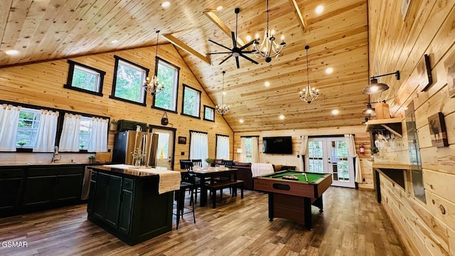 1504 Ginnys Trl, Sevierville, TN 37876 - game room with high vaulted ceiling, a chandelier, wood ceiling, wooden walls, and healthy amount of natural light