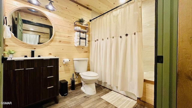 1504 Ginnys Trl, Sevierville, TN 37876 - bathroom featuring wood finished floors, wood walls, vanity, and a shower with shower curtain