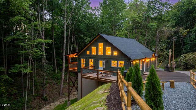 1504 Ginnys Trl, Sevierville, TN 37876 - rear view of property featuring board and batten siding, a shingled roof, and a wooden deck