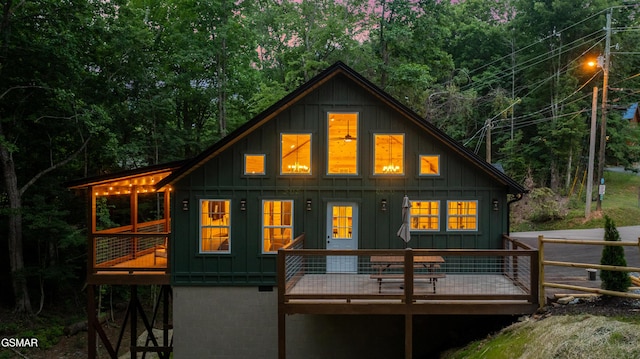 1504 Ginnys Trl, Sevierville, TN 37876 - rear view of property with board and batten siding and a deck