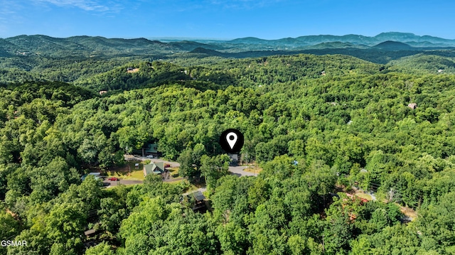 1504 Ginnys Trl, Sevierville, TN 37876 - aerial view of property's location with a heavily wooded area and mountains