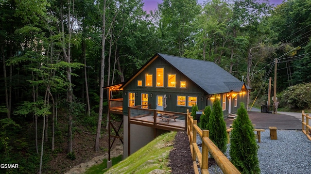 1504 Ginnys Trl, Sevierville, TN 37876 - rear view of property featuring board and batten siding, a shingled roof, and a wooden deck