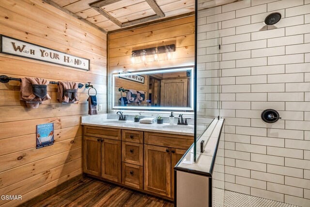 1606 Dove Wing Way, Sevierville, TN 37862 - bathroom with tiled shower, double vanity, wood finished floors, and wood walls