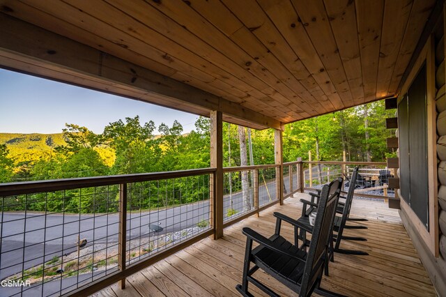 1606 Dove Wing Way, Sevierville, TN 37862 - wooden terrace with a view of trees