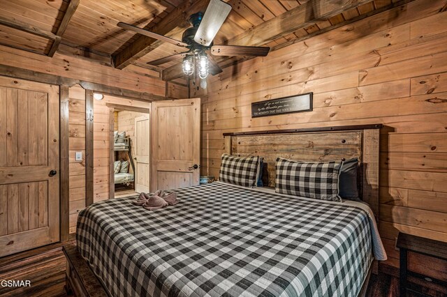 1606 Dove Wing Way, Sevierville, TN 37862 - bedroom featuring wood walls and a wood ceiling with exposed beams