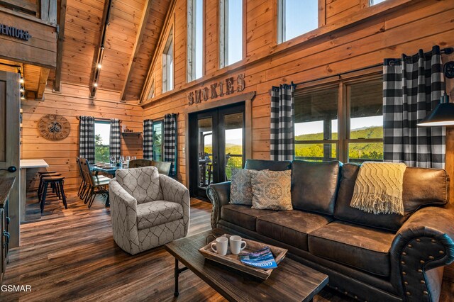 1606 Dove Wing Way, Sevierville, TN 37862 - living area with a wood ceiling with exposed beams, french doors, wood finished floors, wood walls, and high vaulted ceiling