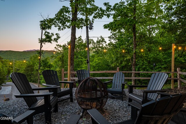 1606 Dove Wing Way, Sevierville, TN 37862 - patio terrace at dusk with a fire pit