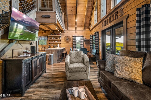 1606 Dove Wing Way, Sevierville, TN 37862 - living room with healthy amount of natural light, wood finished floors, wood walls, a wooden ceiling with exposed beams, and high vaulted ceiling
