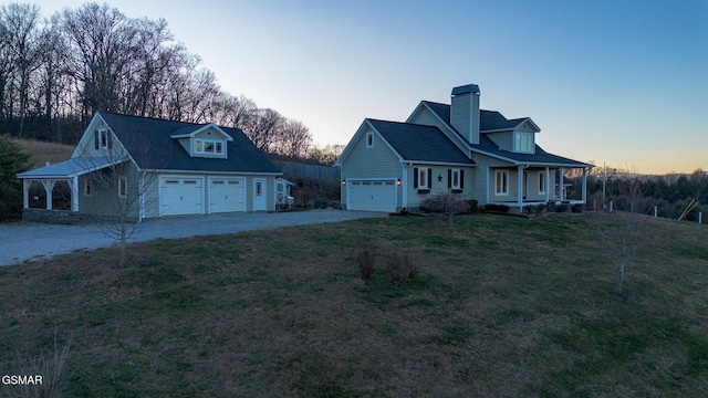 cape cod-style house featuring covered porch