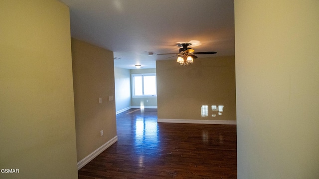 spare room featuring ceiling fan and dark hardwood / wood-style flooring