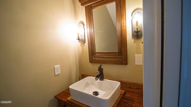 bathroom with vanity and wood-type flooring