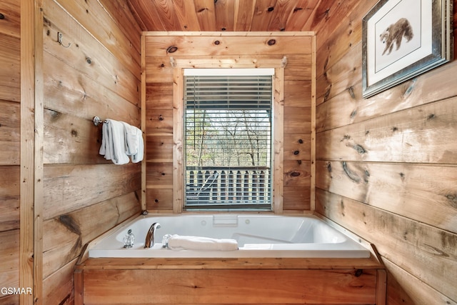 bathroom featuring wooden ceiling, wooden walls, and a tub