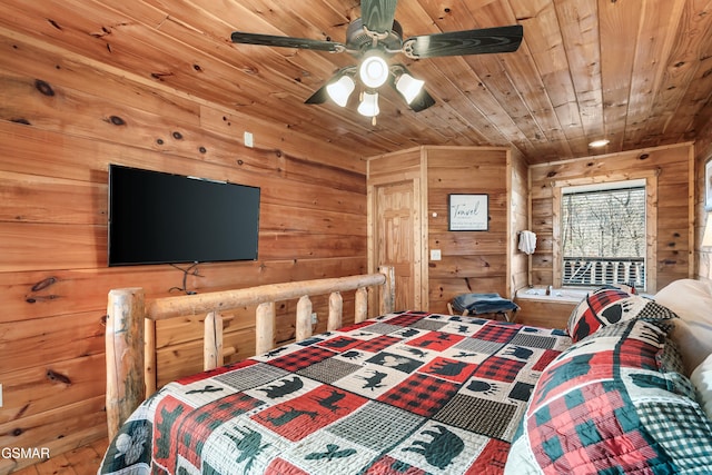 bedroom with wood walls, ceiling fan, and wooden ceiling