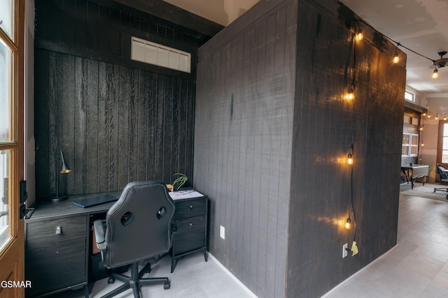 home office featuring wooden walls