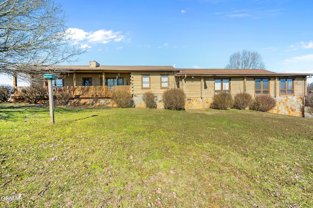 view of front of house featuring crawl space, a front lawn, and a chimney