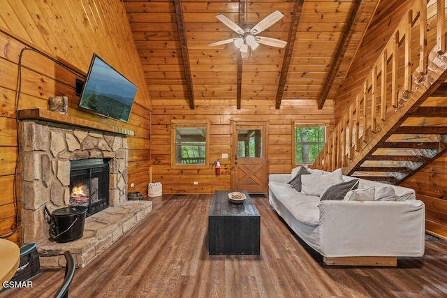 4372 Boogertown Rd Unit 1, Sevierville, TN 37876 - living room with wooden ceiling, wood finished floors, wooden walls, ceiling fan, and a stone fireplace