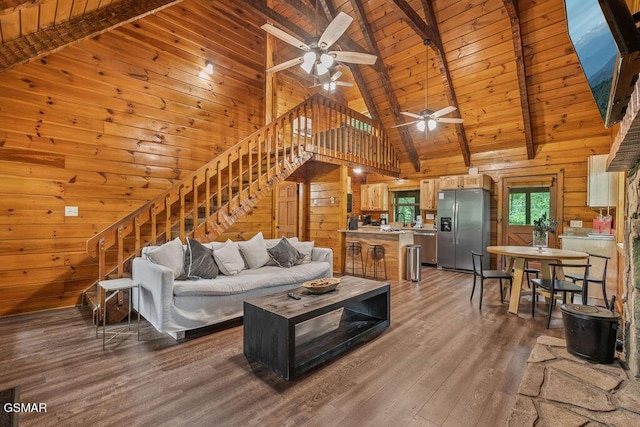 4372 Boogertown Rd Unit 1, Sevierville, TN 37876 - living area with wood walls, stairs, wood finished floors, ceiling fan, and high vaulted ceiling