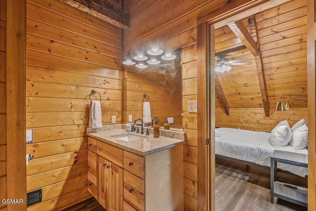 4372 Boogertown Rd Unit 1, Sevierville, TN 37876 - bathroom featuring wooden walls, vanity, wood ceiling, wood finished floors, and lofted ceiling