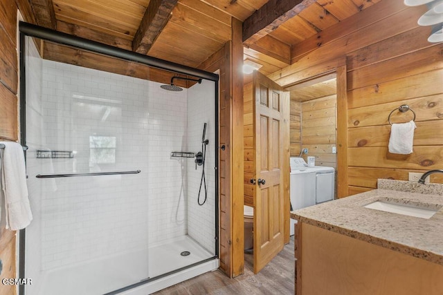 4372 Boogertown Rd Unit 1, Sevierville, TN 37876 - full bathroom featuring wood ceiling with exposed beams, a shower stall, wood finished floors, wooden walls, and vanity