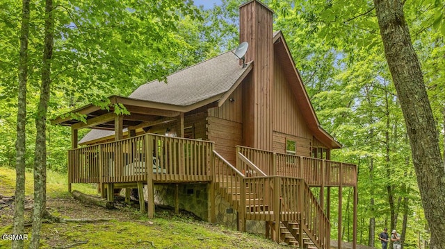 4372 Boogertown Rd Unit 1, Sevierville, TN 37876 - view of side of home with roof with shingles, stairway, a chimney, and a wooden deck