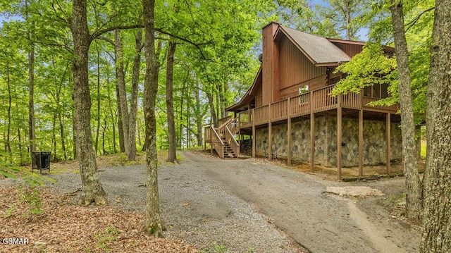 4372 Boogertown Rd Unit 1, Sevierville, TN 37876 - view of home's exterior with stairway, a deck, and roof with shingles