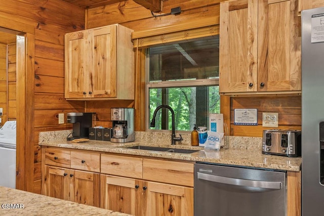 4372 Boogertown Rd Unit 1, Sevierville, TN 37876 - kitchen featuring stainless steel appliances, a sink, wooden walls, light stone countertops, and light brown cabinetry