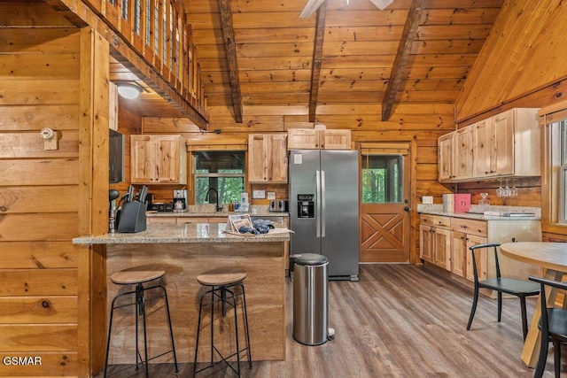 4372 Boogertown Rd Unit 1, Sevierville, TN 37876 - kitchen with stainless steel fridge, light wood finished floors, wood ceiling, wooden walls, and plenty of natural light