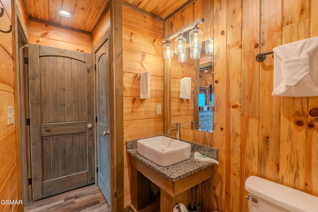 2414 Hackberry Dr, Sevierville, TN 37862 - bathroom featuring wood walls and wood finished floors
