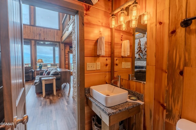 2414 Hackberry Dr, Sevierville, TN 37862 - half bathroom with wood walls and wood finished floors