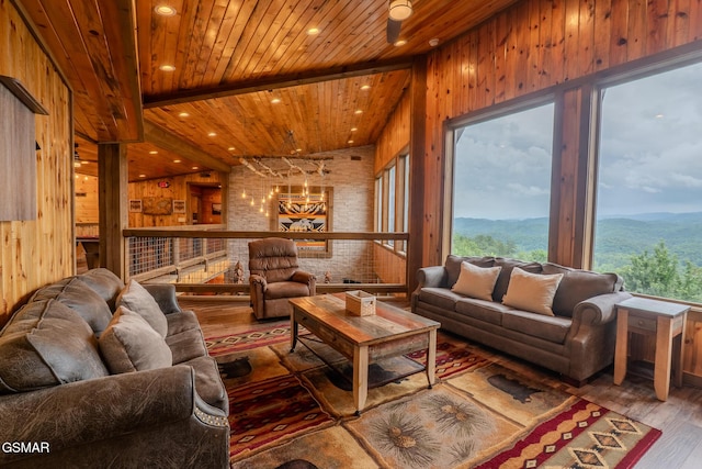 2414 Hackberry Dr, Sevierville, TN 37862 - living area with wood finished floors, wood walls, wood ceiling, a mountain view, and recessed lighting