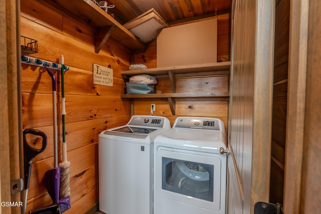 2414 Hackberry Dr, Sevierville, TN 37862 - laundry area featuring washing machine and dryer, wooden ceiling, and wood walls