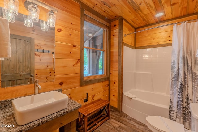 2414 Hackberry Dr, Sevierville, TN 37862 - full bath featuring wood ceiling, wood finished floors, shower / tub combo, and wooden walls