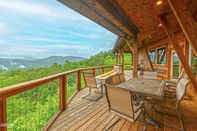 2414 Hackberry Dr, Sevierville, TN 37862 - wooden deck with a mountain view and outdoor dining area