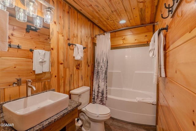 2414 Hackberry Dr, Sevierville, TN 37862 - bathroom featuring wood ceiling, wood finished floors, wooden walls, and shower / bath combo