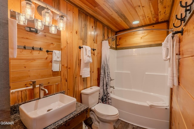2414 Hackberry Dr, Sevierville, TN 37862 - full bathroom featuring wooden walls, wood ceiling, shower / bath combo with shower curtain, and wood finished floors