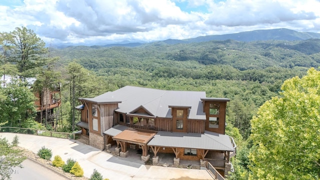 2414 Hackberry Dr, Sevierville, TN 37862 - aerial view of property and surrounding area with a heavily wooded area and a mountain backdrop