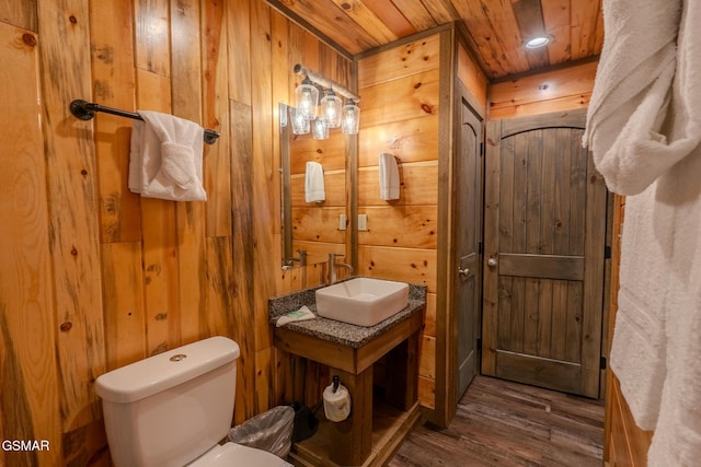 2414 Hackberry Dr, Sevierville, TN 37862 - bathroom featuring wood finished floors, wooden walls, wooden ceiling, and vanity