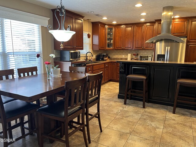1018 Southwind Cir, Dandridge, TN 37725 - kitchen with stainless steel appliances, backsplash, glass insert cabinets, brown cabinets, and recessed lighting