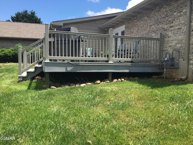 1018 Southwind Cir, Dandridge, TN 37725 - rear view of property with a deck, a lawn, and brick siding