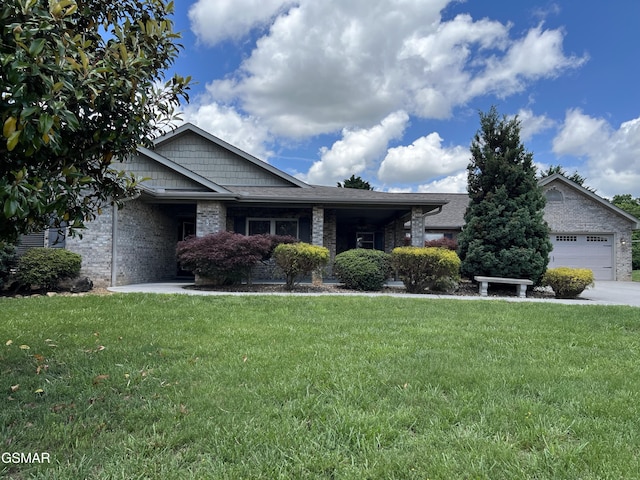 1018 Southwind Cir, Dandridge, TN 37725 - view of front of property with a front yard, brick siding, and an attached garage