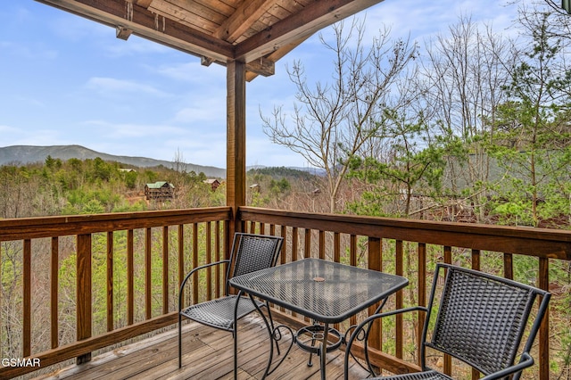 wooden terrace with a mountain view
