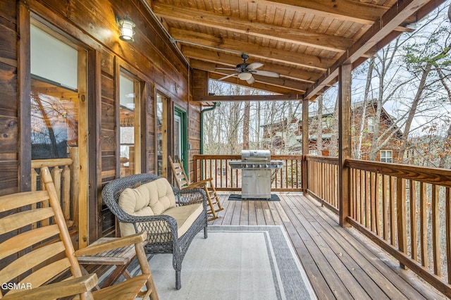 wooden deck featuring a grill and a ceiling fan