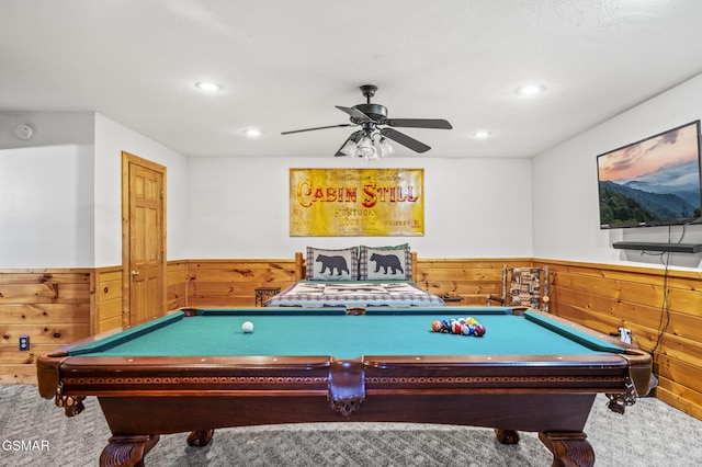 rec room featuring wood walls, recessed lighting, and a wainscoted wall