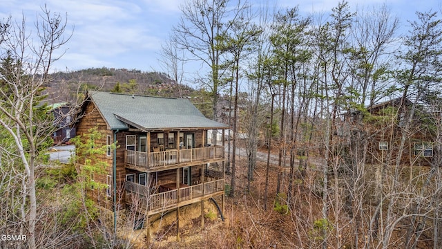exterior space with a shingled roof