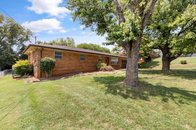 ranch-style home featuring a front yard