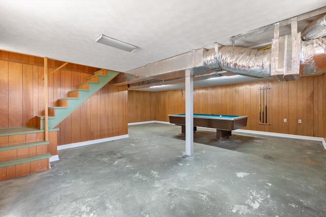 basement with billiards and wood walls