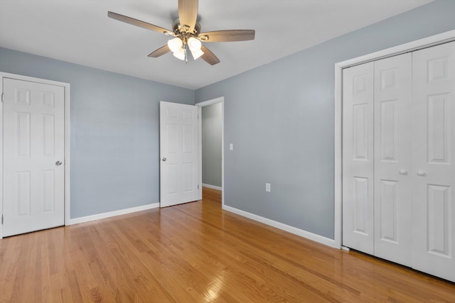 unfurnished bedroom featuring light hardwood / wood-style floors and ceiling fan