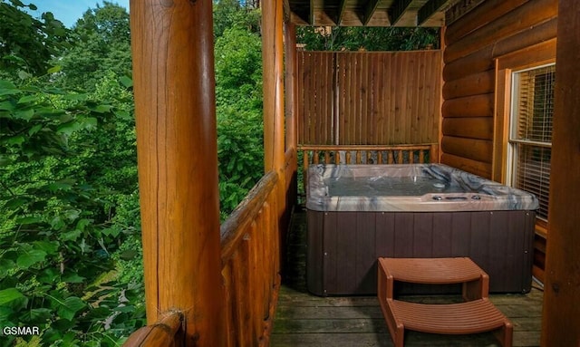 deck featuring a hot tub