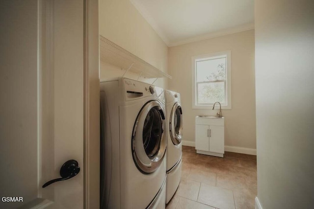 118 Luxury Ln, Dandridge, TN 37725 - laundry area featuring washer and dryer, a sink, crown molding, light tile patterned floors, and baseboards