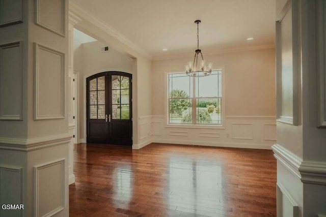 118 Luxury Ln, Dandridge, TN 37725 - unfurnished dining area with a chandelier, wood finished floors, wainscoting, french doors, and ornamental molding
